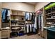 A fully organized walk-in closet with shelves, hanging racks, and storage space at 18944 E Amethyst Dr, Rio Verde, AZ 85263