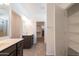 Bathroom with double sinks, tile floors and a linen closet at 19975 W Glenrosa Ave, Litchfield Park, AZ 85340