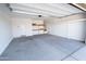 Spacious garage with ample storage shelving and concrete flooring for convenience at 19975 W Glenrosa Ave, Litchfield Park, AZ 85340