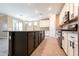 Modern kitchen with island, stainless steel appliances, and white cabinets at 19975 W Glenrosa Ave, Litchfield Park, AZ 85340