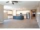 Spacious kitchen featuring white cabinets, an island with bar seating, and modern stainless steel appliances at 19975 W Glenrosa Ave, Litchfield Park, AZ 85340