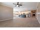 Bright and airy kitchen featuring a dark center island, white cabinetry, stainless steel appliances, and ample natural light at 19975 W Glenrosa Ave, Litchfield Park, AZ 85340