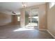 Spacious living room with sliding glass doors to the backyard and tile floors at 19975 W Glenrosa Ave, Litchfield Park, AZ 85340