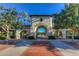 Founder's Park entrance with archways, tile roof, and manicured landscaping at 19975 W Glenrosa Ave, Litchfield Park, AZ 85340