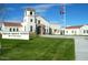 Exterior of Verrado Middle School with flagpole, well-maintained lawn, and clear blue skies at 19975 W Glenrosa Ave, Litchfield Park, AZ 85340