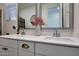 Bright bathroom featuring a double sink vanity with white quartz counters, stylish fixtures, and framed mirrors at 19990 W Turney Ave, Litchfield Park, AZ 85340