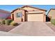 Single-story home featuring an attached garage, well-kept landscaping and appealing curb appeal at 19990 W Turney Ave, Litchfield Park, AZ 85340