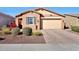 Charming single-story home with a well-manicured front yard and attached two-car garage at 19990 W Turney Ave, Litchfield Park, AZ 85340