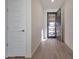 Bright and airy foyer with tiled floors and modern white doors, creating a welcoming entrance at 19990 W Turney Ave, Litchfield Park, AZ 85340