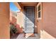 Home entry featuring a decorative security door and a 'Home Where We Are' welcome mat at 19990 W Turney Ave, Litchfield Park, AZ 85340