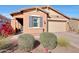 Inviting home with desert landscaping, a charming exterior, and a cozy front entrance at 19990 W Turney Ave, Litchfield Park, AZ 85340