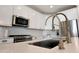 Close-up of the sink and countertops, highlighting modern fixtures and finishes at 19990 W Turney Ave, Litchfield Park, AZ 85340