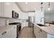 Spacious kitchen with modern appliances, white cabinetry, and ample counter space at 19990 W Turney Ave, Litchfield Park, AZ 85340