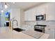 Bright kitchen featuring white cabinets, stainless steel appliances, quartz countertops, and subway tile backsplash at 19990 W Turney Ave, Litchfield Park, AZ 85340