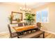 Elegant dining room featuring a wood table, stylish chairs, and a bright window at 20138 E Estrella Rd, Queen Creek, AZ 85142