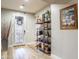 Inviting entryway with decorative door, stylish shelving, and neutral color palette for a modern touch at 20138 E Estrella Rd, Queen Creek, AZ 85142