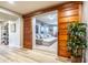 Hallway view showcasing custom wooden sliding doors opening to a cozy media room perfect for movie nights at 20138 E Estrella Rd, Queen Creek, AZ 85142