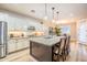 Spacious kitchen featuring a large center island with seating and stainless steel appliances at 20138 E Estrella Rd, Queen Creek, AZ 85142