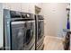 Spacious laundry room featuring a washer and dryer and plenty of cabinet storage at 20138 E Estrella Rd, Queen Creek, AZ 85142