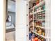 Well-stocked pantry with organized shelves and a variety of food items at 20138 E Estrella Rd, Queen Creek, AZ 85142