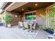 Covered patio with an outdoor dining table and a ceiling fan at 20138 E Estrella Rd, Queen Creek, AZ 85142