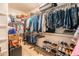 Spacious walk-in closet with custom shelving and organized storage solutions at 20138 E Estrella Rd, Queen Creek, AZ 85142