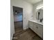 Bright bathroom features a modern vanity with shaker cabinets, a vessel sink, and stylish fixtures at 2034 E Charleston Ave, Phoenix, AZ 85022