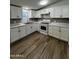 Modern kitchen featuring stainless steel appliances, granite countertops, and ample cabinet space at 2034 E Charleston Ave, Phoenix, AZ 85022