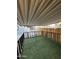 Covered patio with artificial turf, wood fence and metal fence at 2034 E Charleston Ave, Phoenix, AZ 85022