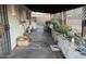 Image of a back porch cluttered with household items at 2045 W Colter St, Phoenix, AZ 85015