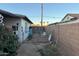 The backyard is partially enclosed by a block wall, and partially by chain link fence at 2045 W Colter St, Phoenix, AZ 85015