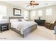 Spacious bedroom with a king-size bed, ample natural light, and comfortable seating area at 21134 W Green St, Buckeye, AZ 85396