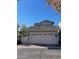 Attached garage with ample space and classic detailing, enhancing the curb appeal of this home at 21134 W Green St, Buckeye, AZ 85396