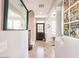 Bright hallway featuring concrete floors, comic book art and natural lighting from the front door at 21134 W Green St, Buckeye, AZ 85396