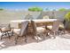 Enjoy outdoor dining at the built-in bar with ample seating overlooking the landscaped backyard at 21134 W Green St, Buckeye, AZ 85396