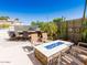 Backyard patio features a built-in bar, fire pit, and ample seating for outdoor entertaining at 21134 W Green St, Buckeye, AZ 85396