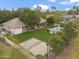 Aerial view of sprawling green lawn, mature trees, and a gorgeous pool with a covered patio at 2170 E Caroline Ln, Tempe, AZ 85284