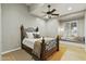 Charming bedroom with a decorative bed frame, a built-in window seat, and a ceiling fan, creating a cozy retreat at 2170 E Caroline Ln, Tempe, AZ 85284