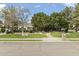 Street view of a landscaped front yard featuring mature trees and a walkway leading to the entrance at 2170 E Caroline Ln, Tempe, AZ 85284