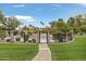 Gated pool area with lush landscaping and a paved walkway at 2170 E Caroline Ln, Tempe, AZ 85284