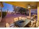 Relaxing covered back patio with outdoor dining set and a ceiling fan at 22813 N Del Monte Dr, Sun City West, AZ 85375