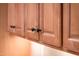 Close up of bathroom cabinets in a light wood finish with black pulls at 22813 N Del Monte Dr, Sun City West, AZ 85375