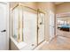 Modern bathroom with a glass shower enclosure and access to the primary suite at 22813 N Del Monte Dr, Sun City West, AZ 85375