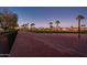 Beautiful sunset view of the golf course, lined with palm trees, offering stunning views and a serene atmosphere at 22813 N Del Monte Dr, Sun City West, AZ 85375