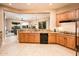 Stylish kitchen with granite counters and backsplash opens to the Gathering room at 22813 N Del Monte Dr, Sun City West, AZ 85375