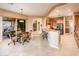 Open-concept kitchen with stainless steel appliances and cozy dining space at 22813 N Del Monte Dr, Sun City West, AZ 85375