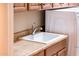 Laundry room sink and countertop next to a white washing machine and dryer at 22813 N Del Monte Dr, Sun City West, AZ 85375