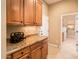 Pantry area with ample storage and granite countertops, great for organization and easy access at 22813 N Del Monte Dr, Sun City West, AZ 85375