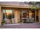 Covered patio with neutral-colored seating and a dining table at 22813 N Del Monte Dr, Sun City West, AZ 85375