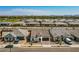 Aerial view of a residential community with tile-roofed homes and mountain views in the distance at 22891 E Via Del Sol --, Queen Creek, AZ 85142